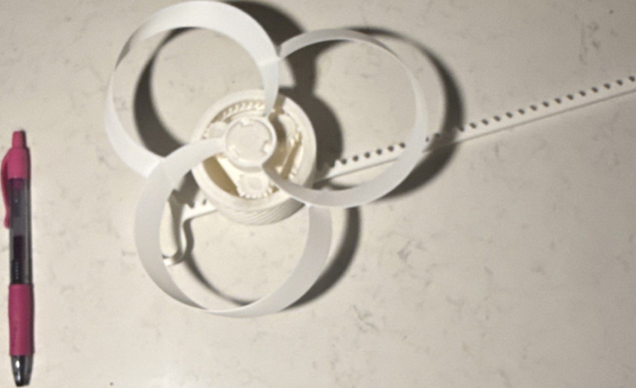 White 3d printed toy with 3 Blades, Plastic Base and Handle all plastic